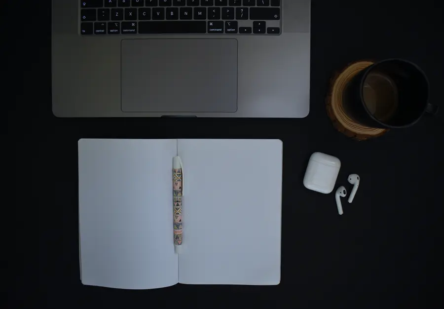 Minimal desk, laptop and notebook