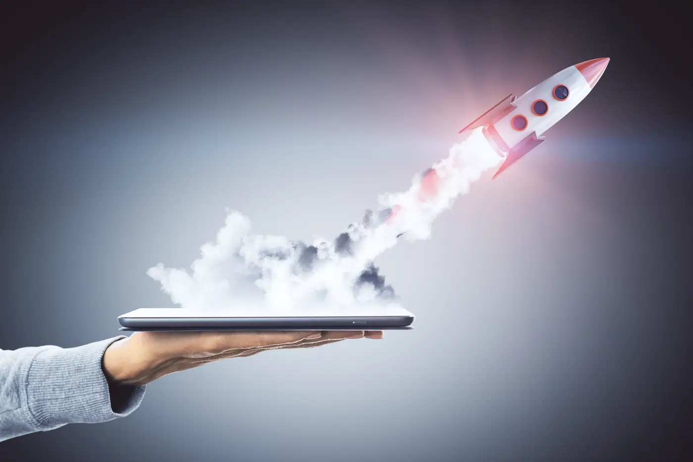 Rocket launching straight out of a tablet screen