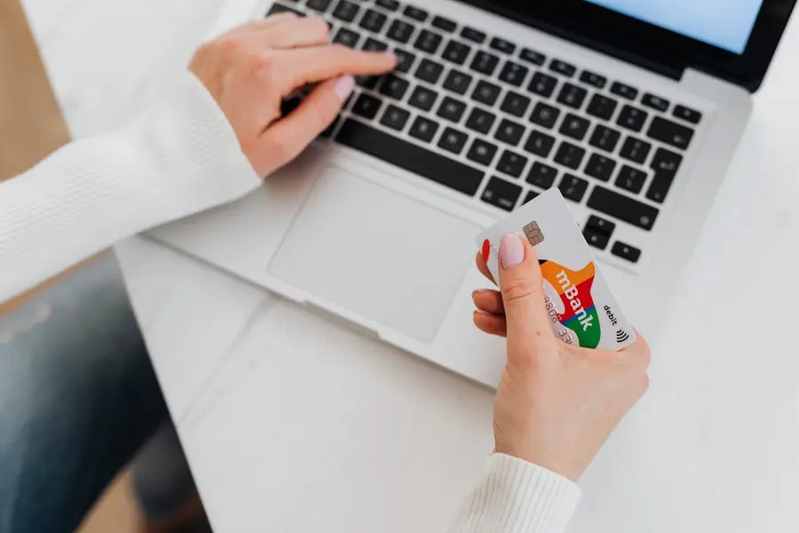 Customer paying online with a credit card at a laptop